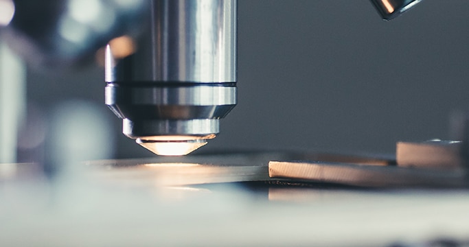 Close up of a microscope lens